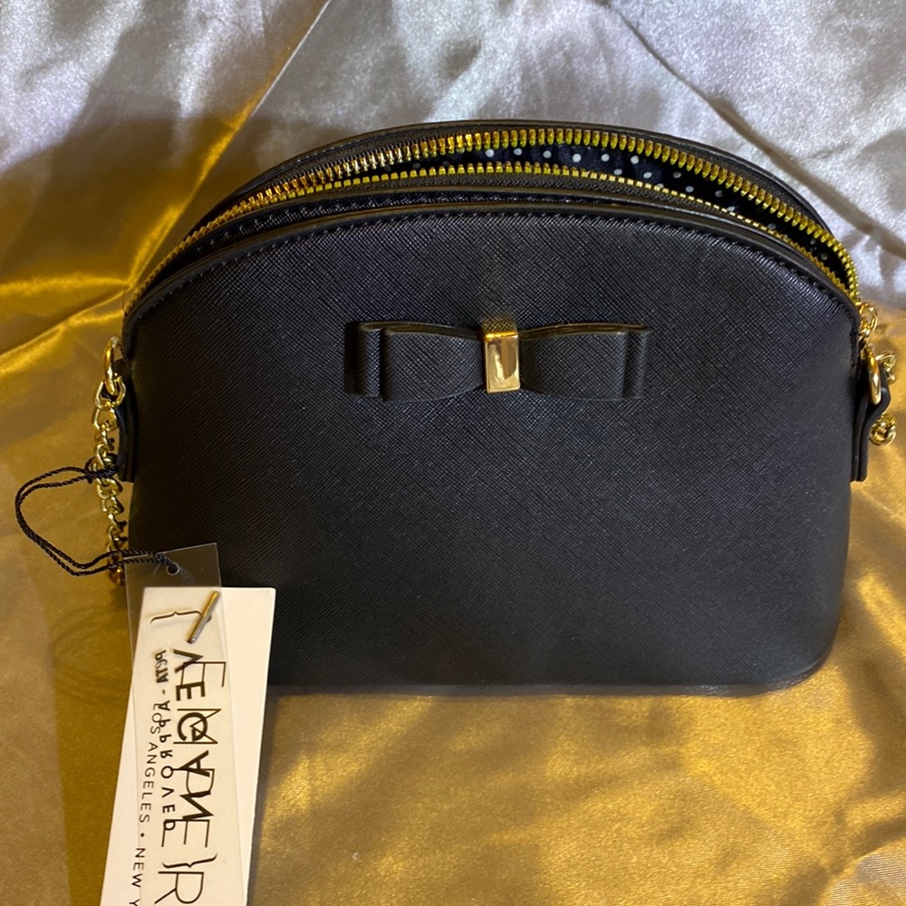 Perfect evening bag. Black with gold accents.